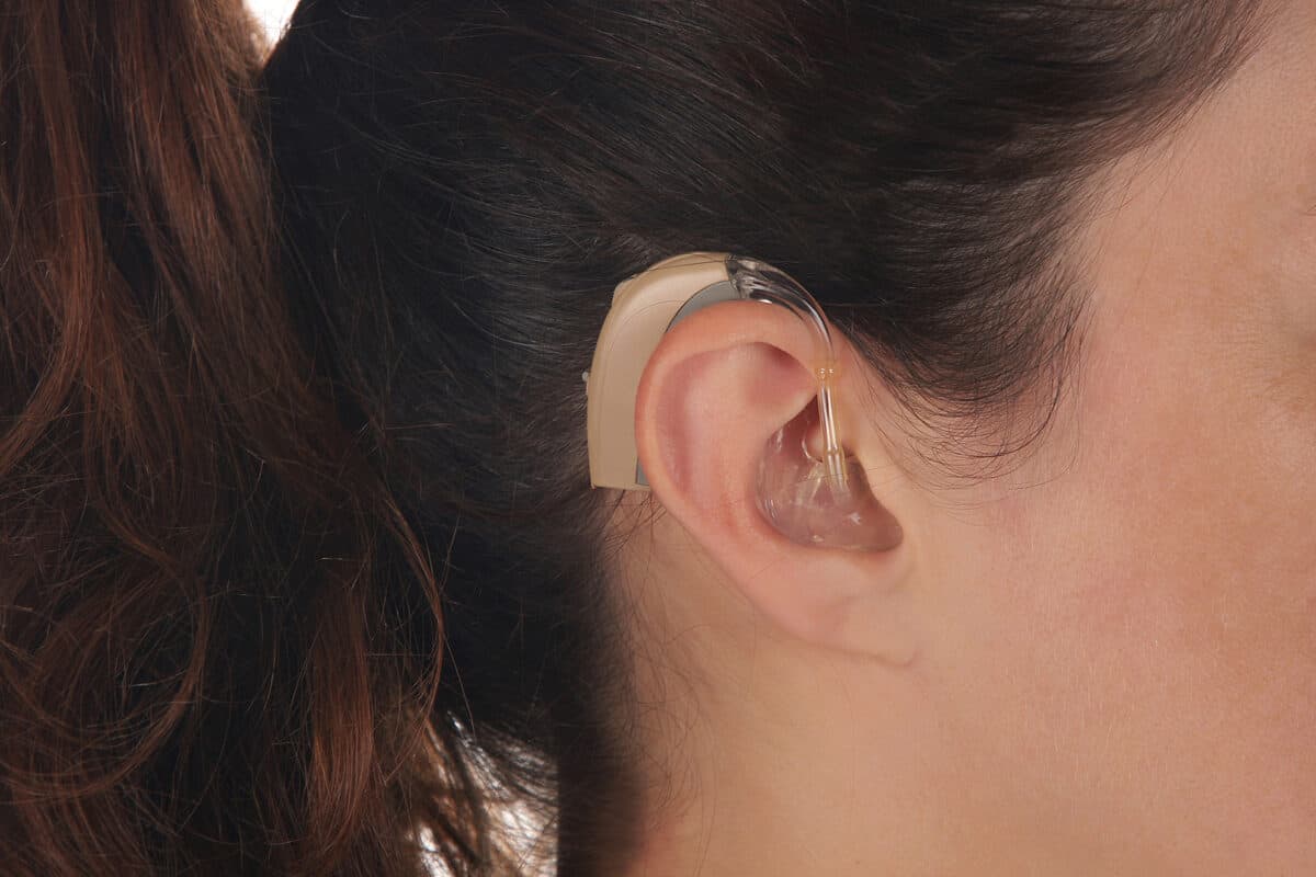 Closeup of woman wearing hearing aids